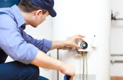 Plumber repairing a water heater in Sanford, FL